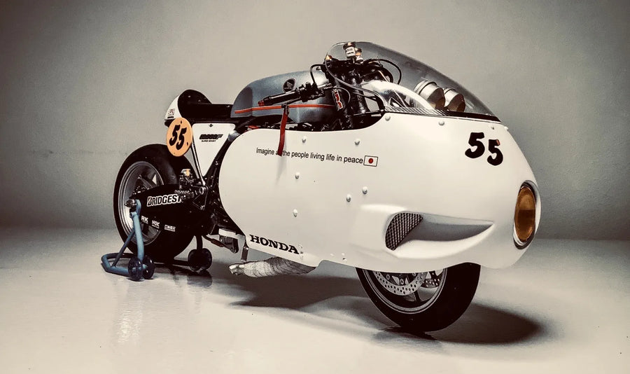 Wrap the front wheel in a one-piece fairing and only the amber lamp stays visible.